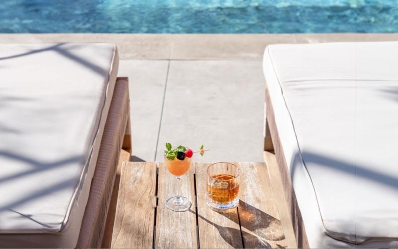 cocktails on a table by a pool
