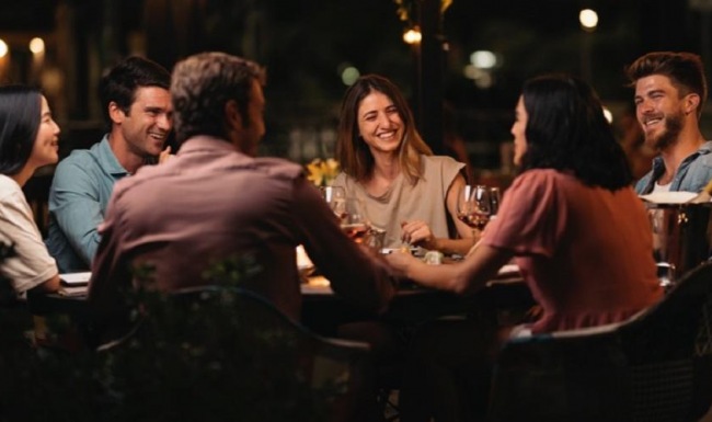 Close to the center of everything a group of people sitting at a table